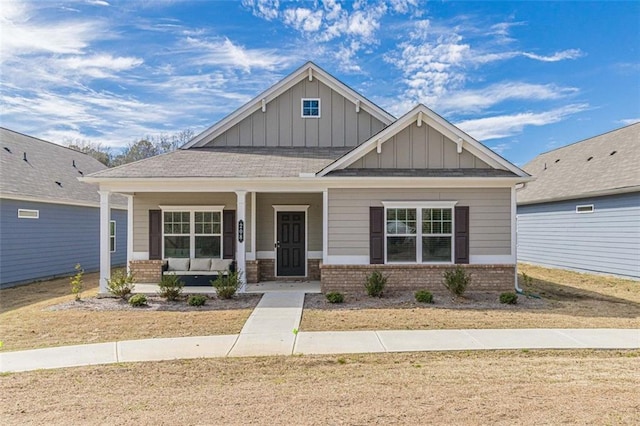 craftsman inspired home featuring covered porch