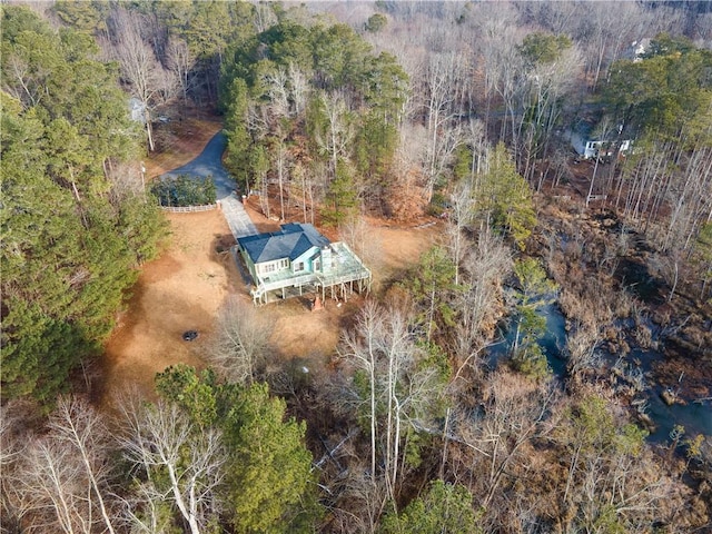 drone / aerial view featuring a view of trees