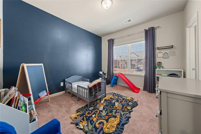 bedroom featuring light carpet