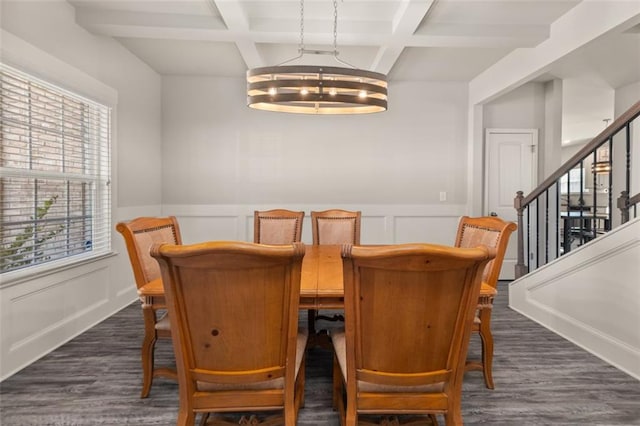 dining area featuring a chandelier, plenty of natural light, and coffered ceiling