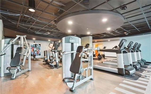 workout area with wood-type flooring