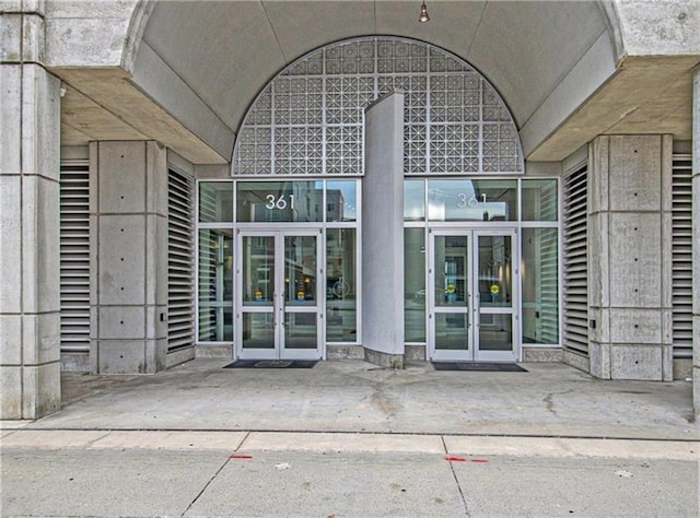 view of exterior entry featuring french doors