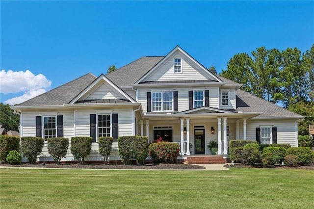 view of front of home featuring covered porch and a front yard