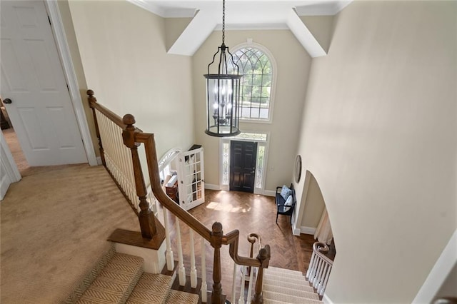 4575 Dairy Way, Peachtree Corners, GA 30092 - foyer entrance with crown molding, a chandelier, baseboards, and a high ceiling