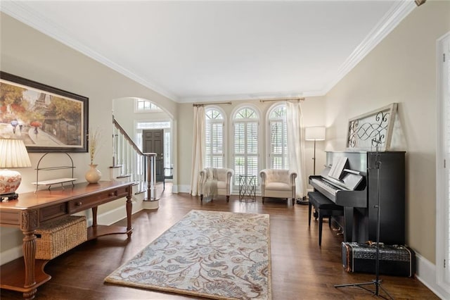 4575 Dairy Way, Peachtree Corners, GA 30092 - living room with crown molding, arched walkways, stairway, wood finished floors, and baseboards