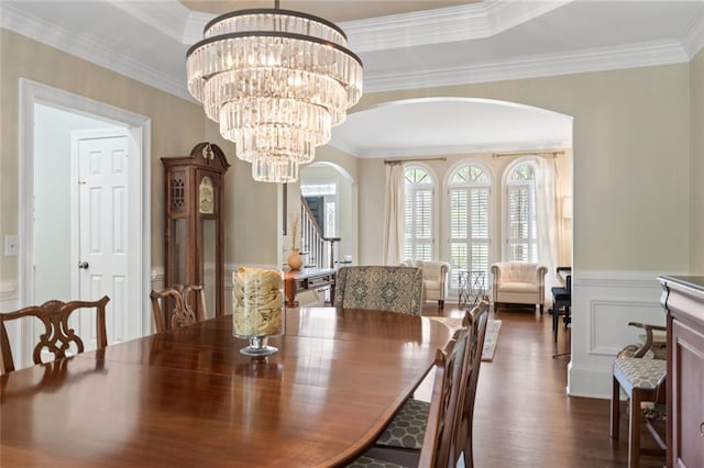4575 Dairy Way, Peachtree Corners, GA 30092 - dining room featuring arched walkways, dark wood-type flooring, crown molding, wainscoting, and stairway