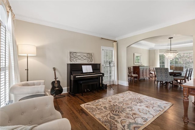 4575 Dairy Way, Peachtree Corners, GA 30092 - living area featuring arched walkways, ornamental molding, wood finished floors, baseboards, and a tray ceiling