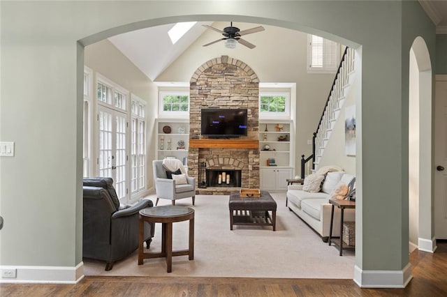 4575 Dairy Way, Peachtree Corners, GA 30092 - living area featuring arched walkways, stairs, baseboards, wood finished floors, and ceiling fan