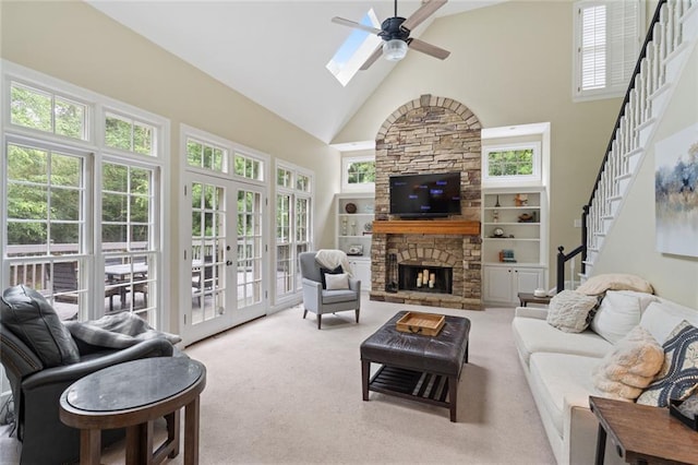 4575 Dairy Way, Peachtree Corners, GA 30092 - carpeted living area with high vaulted ceiling, a ceiling fan, french doors, stairway, and a stone fireplace