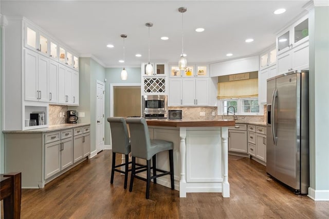 4575 Dairy Way, Peachtree Corners, GA 30092 - kitchen featuring appliances with stainless steel finishes, backsplash, dark wood finished floors, white cabinets, and recessed lighting