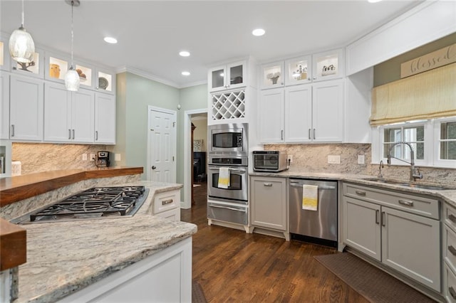 4575 Dairy Way, Peachtree Corners, GA 30092 - kitchen featuring stainless steel appliances, a sink, a warming drawer, ornamental molding, and dark wood finished floors