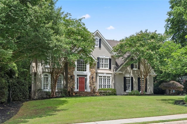 4575 Dairy Way, Peachtree Corners, GA 30092 - view of front facade featuring stucco siding, a front lawn, and stone siding