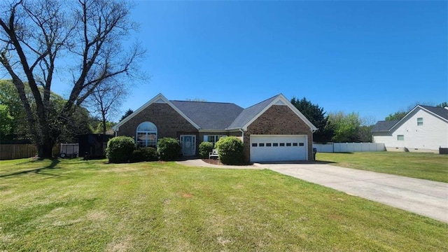 116 Ridge Xing, Temple, GA 30179 - view of front of property featuring an attached garage, fence, concrete driveway, brick siding, and a front lawn