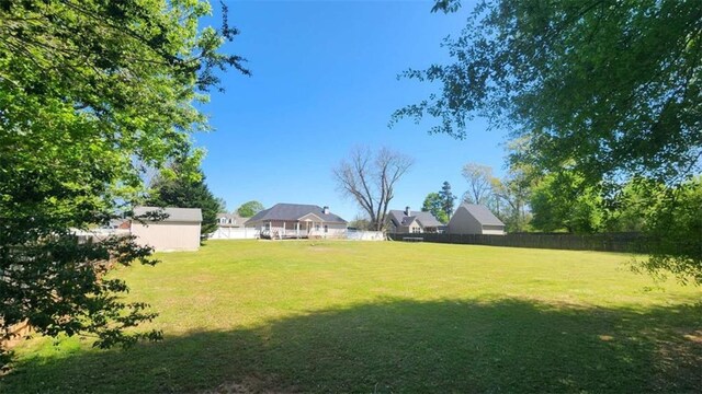 116 Ridge Xing, Temple, GA 30179 - view of yard with an outbuilding and fence