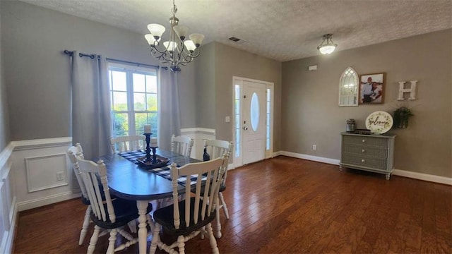 116 Ridge Xing, Temple, GA 30179 - dining room featuring a chandelier, a textured ceiling, wood finished floors, and visible vents