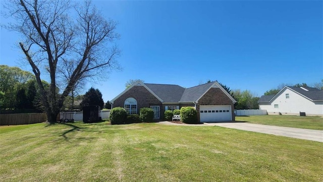 116 Ridge Xing, Temple, GA 30179 - view of front facade with driveway, fence, an attached garage, and a front lawn