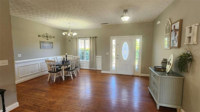 116 Ridge Xing, Temple, GA 30179 - entryway with a textured ceiling, an inviting chandelier, and wood finished floors