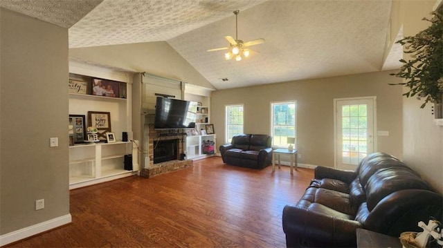 116 Ridge Xing, Temple, GA 30179 - living area featuring a fireplace, a textured ceiling, a ceiling fan, wood finished floors, and baseboards