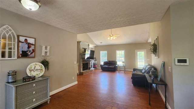 116 Ridge Xing, Temple, GA 30179 - interior space featuring a textured ceiling, wood finished floors, baseboards, and lofted ceiling
