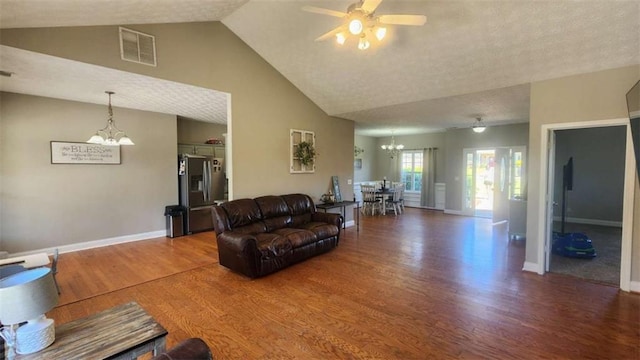 116 Ridge Xing, Temple, GA 30179 - living room featuring visible vents, baseboards, wood finished floors, and ceiling fan with notable chandelier