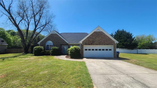 116 Ridge Xing, Temple, GA 30179 - view of front of house featuring an attached garage, fence, driveway, and a front lawn