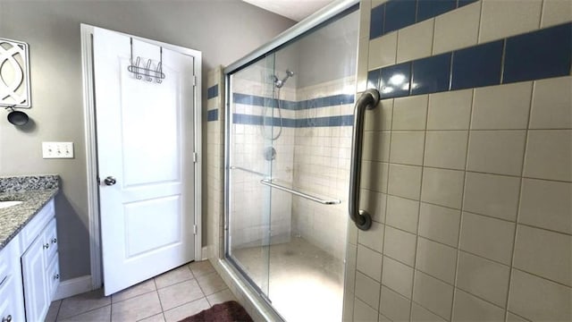 116 Ridge Xing, Temple, GA 30179 - bathroom featuring tile patterned flooring, vanity, and a stall shower
