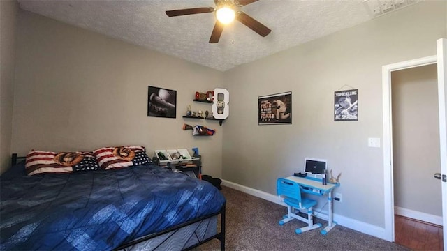116 Ridge Xing, Temple, GA 30179 - carpeted bedroom with baseboards, a ceiling fan, and a textured ceiling