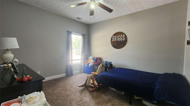 116 Ridge Xing, Temple, GA 30179 - carpeted bedroom with visible vents, baseboards, a ceiling fan, and a textured ceiling
