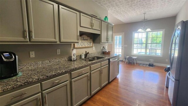 116 Ridge Xing, Temple, GA 30179 - kitchen with gray cabinetry, light wood-style floors, a sink, and appliances with stainless steel finishes
