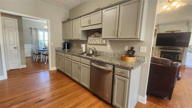 116 Ridge Xing, Temple, GA 30179 - kitchen with gray cabinets, light wood-type flooring, stainless steel dishwasher, and a sink