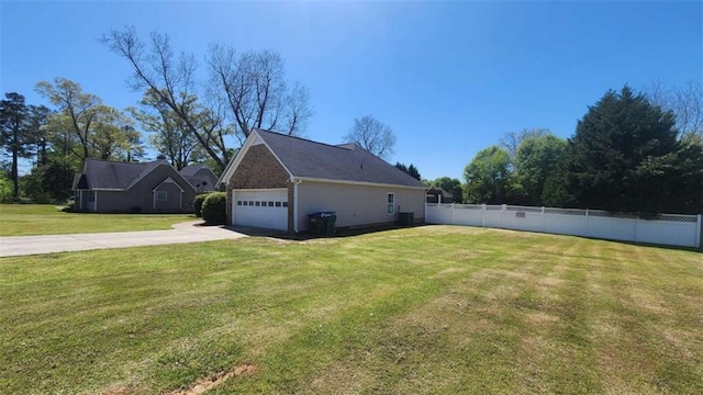 116 Ridge Xing, Temple, GA 30179 - view of side of home featuring an attached garage, driveway, fence, and a lawn