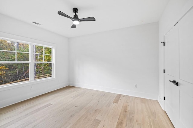 unfurnished room featuring ceiling fan and light hardwood / wood-style floors