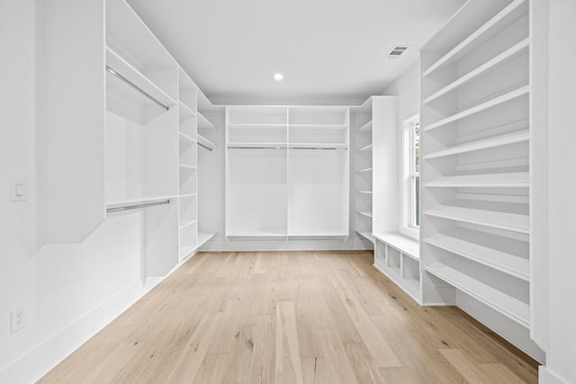 spacious closet featuring light hardwood / wood-style flooring