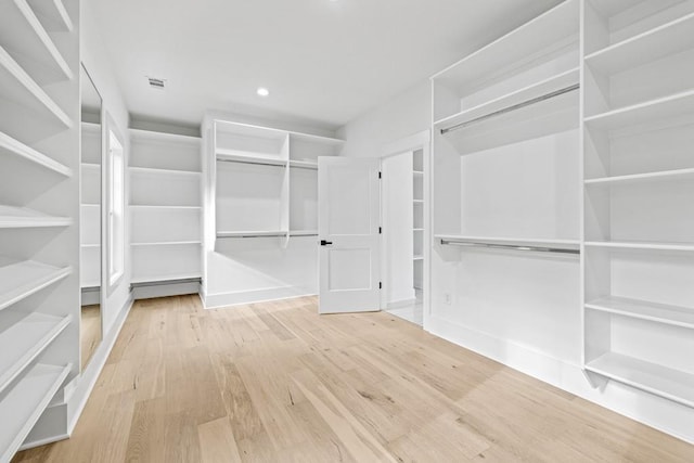 walk in closet featuring hardwood / wood-style flooring