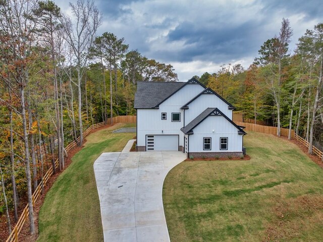 view of front of property with a garage and a front yard