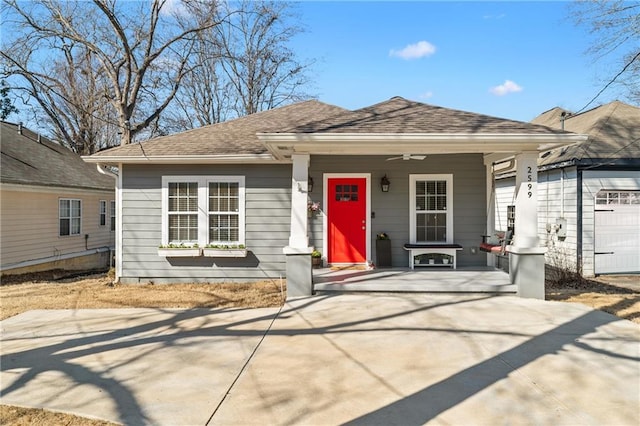 view of front of home with a porch and roof with shingles