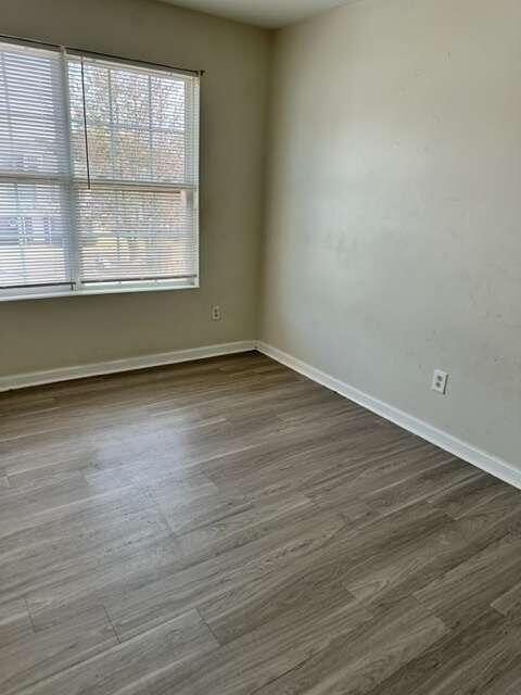 spare room featuring dark hardwood / wood-style flooring