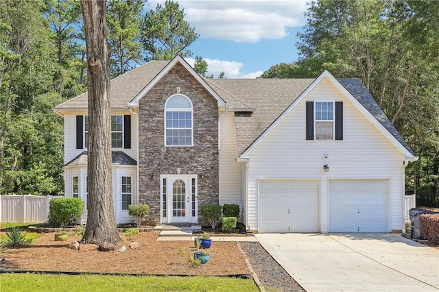 view of front of property with a garage