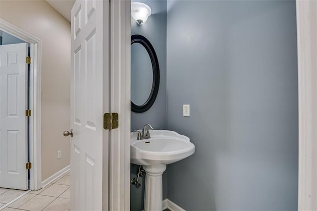 bathroom featuring tile patterned flooring and baseboards