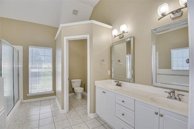 full bathroom with tile patterned floors, lofted ceiling, toilet, double vanity, and baseboards