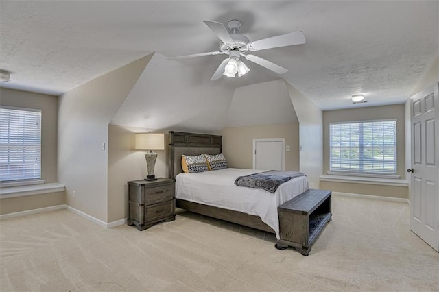 bedroom with carpet flooring, baseboards, a textured ceiling, and ceiling fan