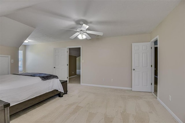 bedroom featuring light carpet, baseboards, and a ceiling fan
