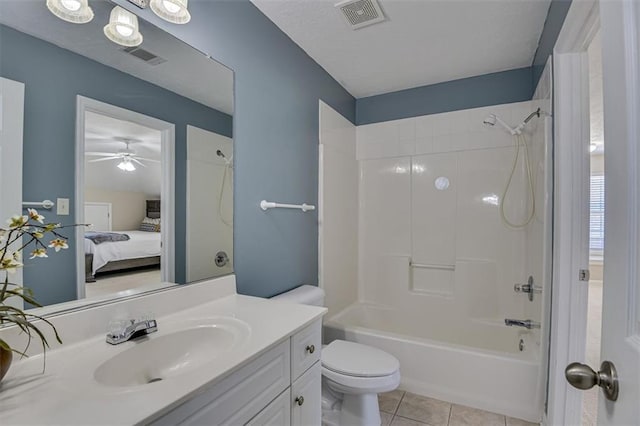 ensuite bathroom featuring tile patterned floors, vanity, toilet, bathtub / shower combination, and a ceiling fan