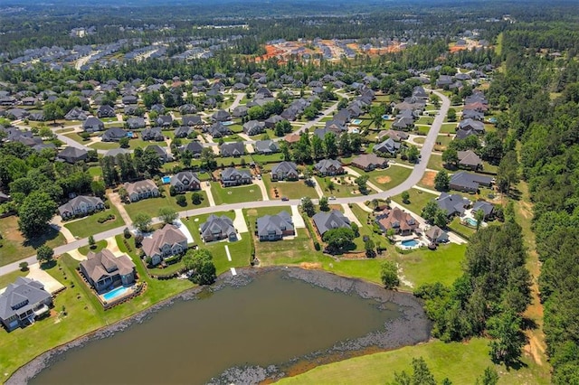 aerial overview of property's location featuring a nearby body of water and nearby suburban area