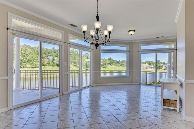 unfurnished dining area with baseboards, a chandelier, crown molding, and healthy amount of natural light