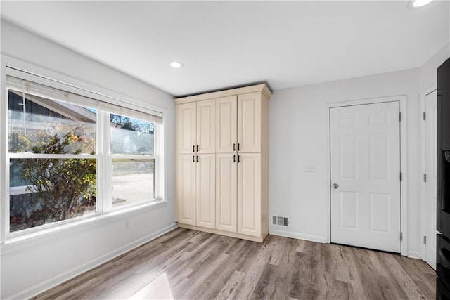 unfurnished bedroom featuring light hardwood / wood-style floors