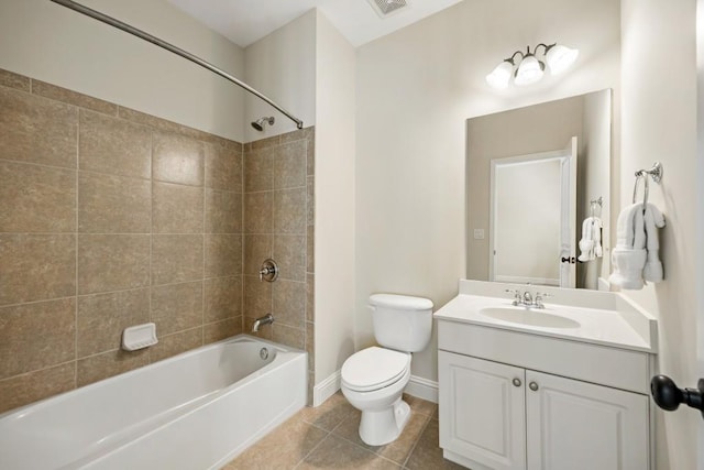 full bathroom featuring shower / bathtub combination, toilet, vanity, tile patterned flooring, and baseboards