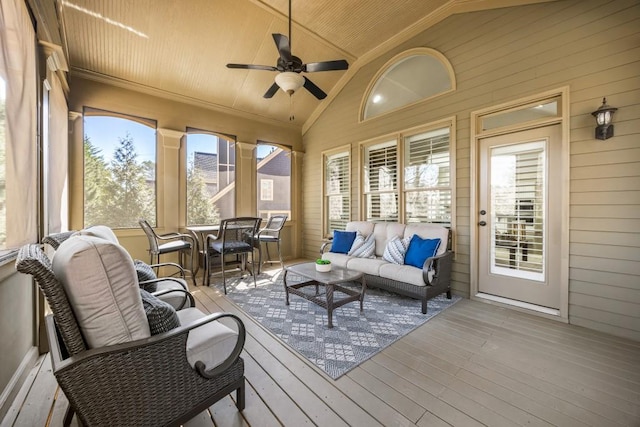 sunroom featuring a ceiling fan, wood ceiling, and vaulted ceiling