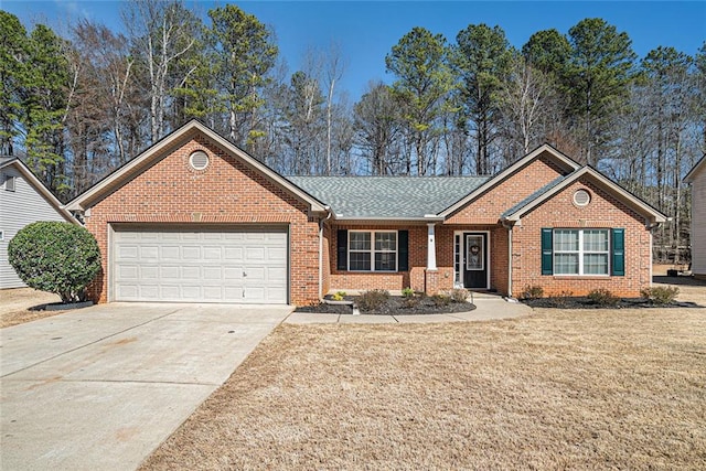 single story home featuring a garage, brick siding, a shingled roof, concrete driveway, and a front lawn