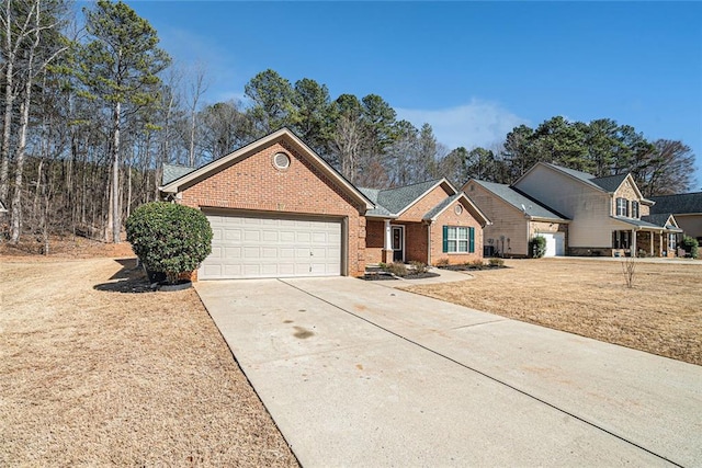 view of front of house featuring a garage, concrete driveway, brick siding, and a front yard